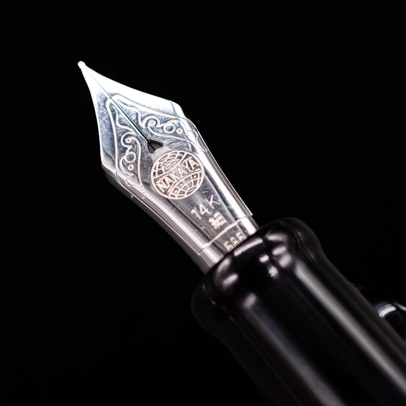 A macro shot of the nib with its intricate detailing and logo engraving for the Nakaya Piccola Long Fountain Pen - Kuro Tame.