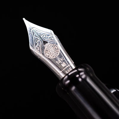 A macro shot of the nib with its intricate detailing and logo engraving for the Nakaya Piccola Long Fountain Pen - Kuro Tame.
