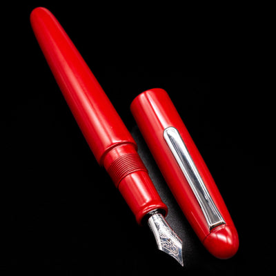 A full view of the Nakaya Portable Writer Fountain Pen - AraiShu uncapped, with its cap laying next to the pen. 