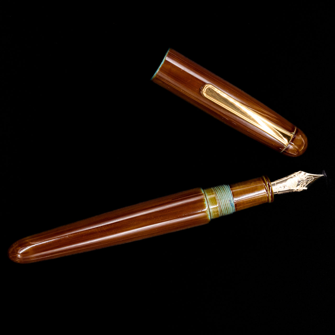 An overhead view of the Nakaya Portable Writer Fountain Pen - Heki Tamenuri uncapped.
