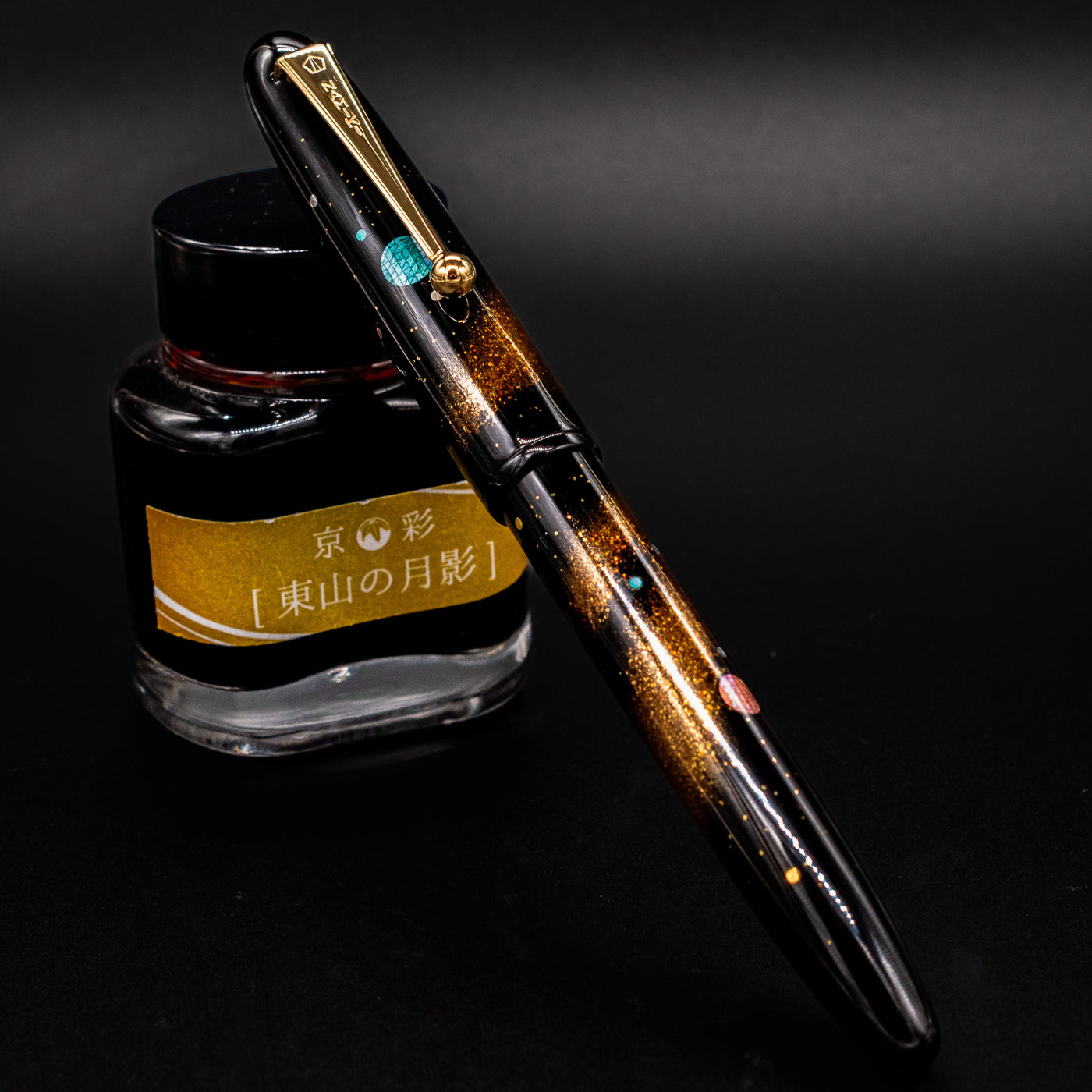 Pen resting inside Japanese wooden box – Featuring the lacquered pen elegantly presented with ink bottle and signed documentation.