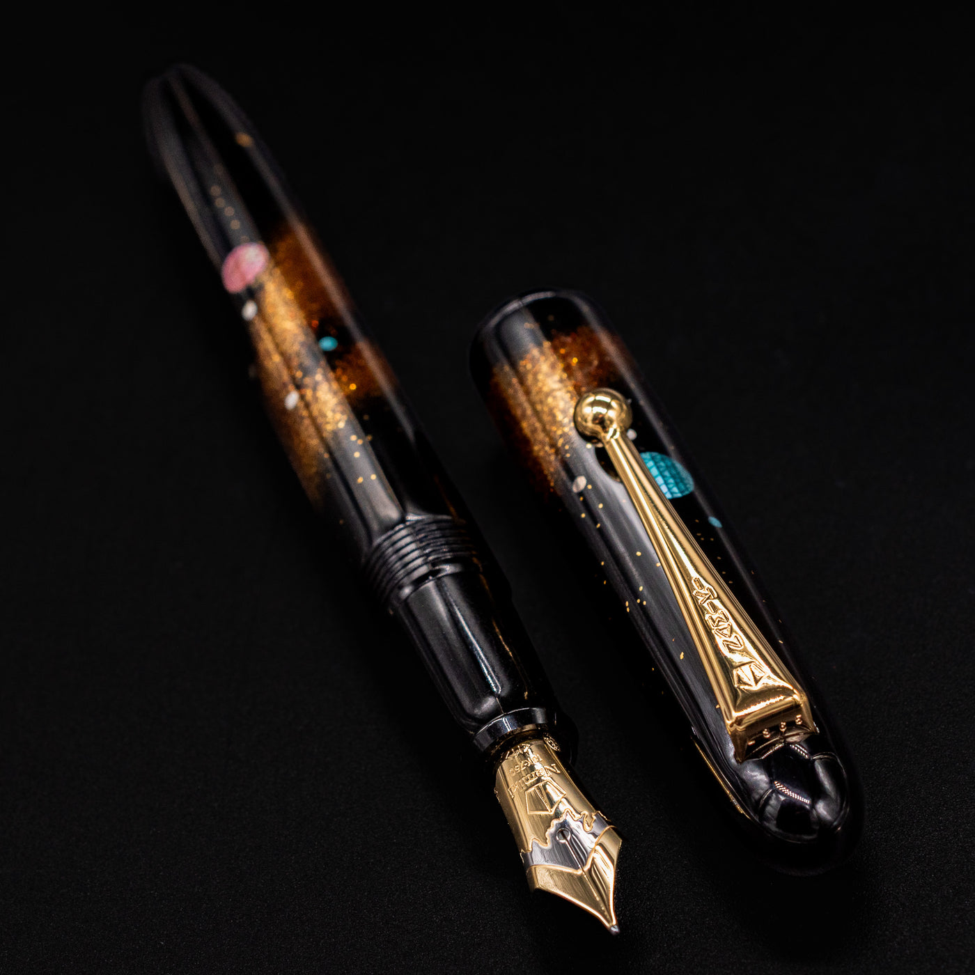 Side angle of pen with cap on – Highlighting the deep black urushi lacquer and iridescent details reflecting starlit skies.