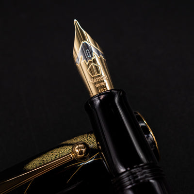 Nib close-up of the uncapped pen – Displaying the 18k gold nib engraved with the Namiki logo, known for smooth, luxurious writing.