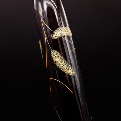 Close-up of cattail plant design – Featuring intricate chinkin engraving of delicate cattail plants, symbolizing nature’s tranquility.