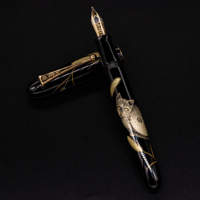 Pen uncapped, resting on top of cap – Emphasizing the flowing harmony between barrel and cap artwork when displayed together.