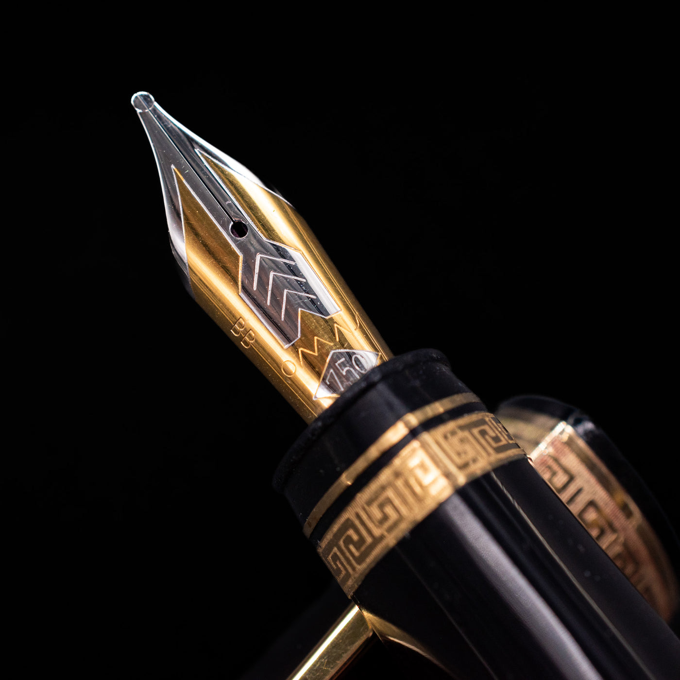  A macro shot of the nib with its intricate detailing and logo engraving for the OMAS 360 Dark Blue Fountain Pen - Preowned.