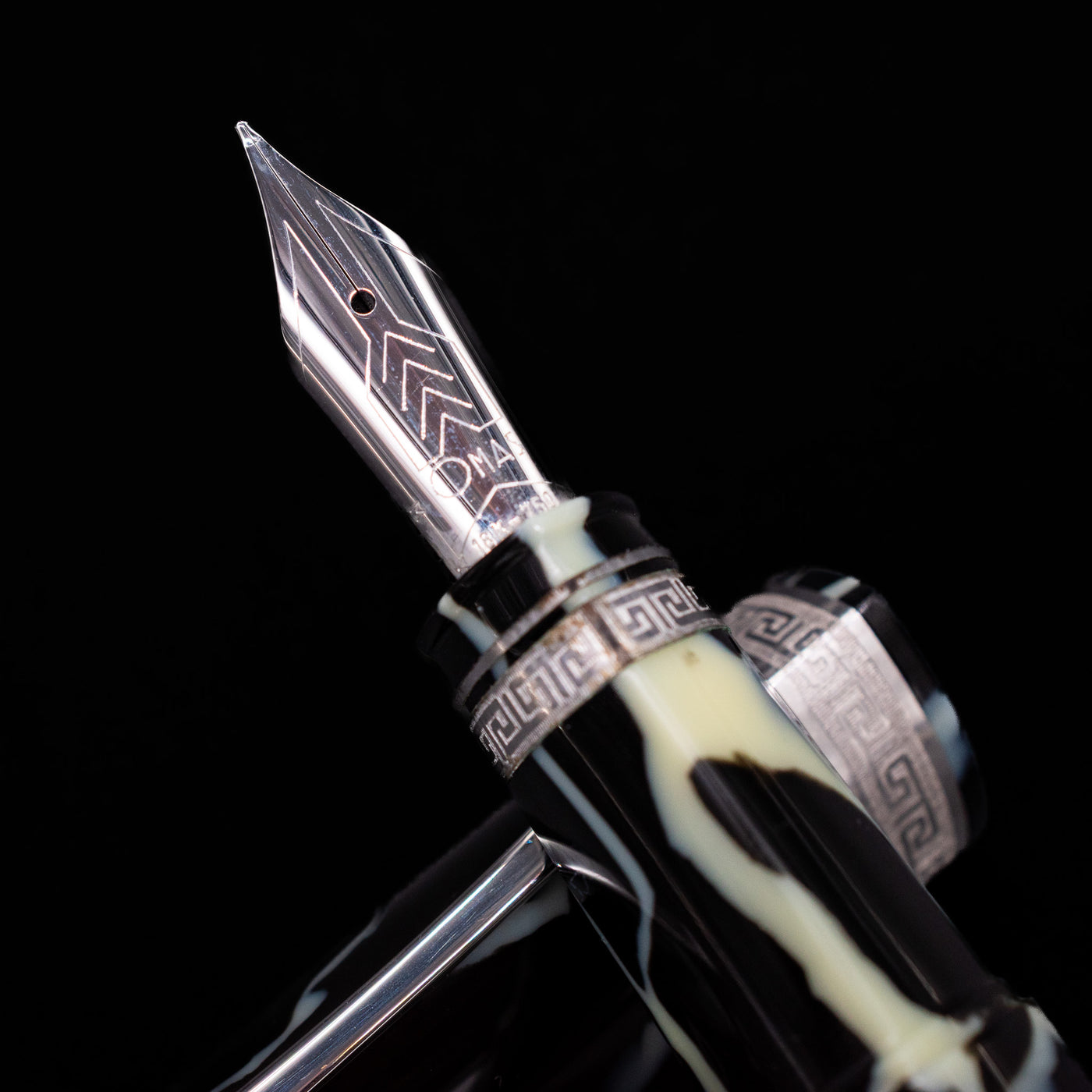 Close-up of the 18k gold nib on the preowned OMAS 360 Wild Celluloid fountain pen, showing fine engravings and the brand logo.