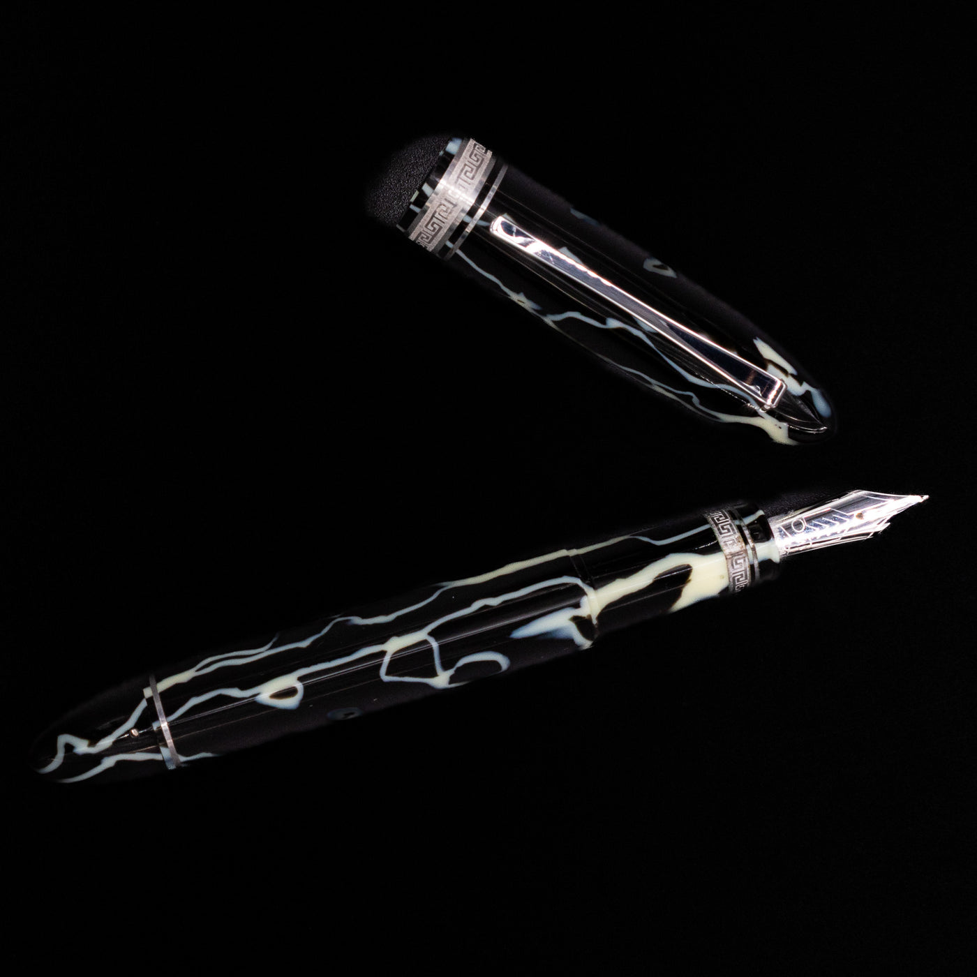 Overhead view of the preowned OMAS 360 Wild Celluloid fountain pen, emphasizing the triangular design and the intricate marbled celluloid pattern.