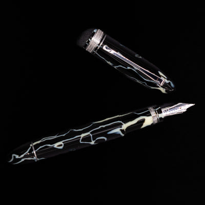 Overhead view of the preowned OMAS 360 Wild Celluloid fountain pen, emphasizing the triangular design and the intricate marbled celluloid pattern.