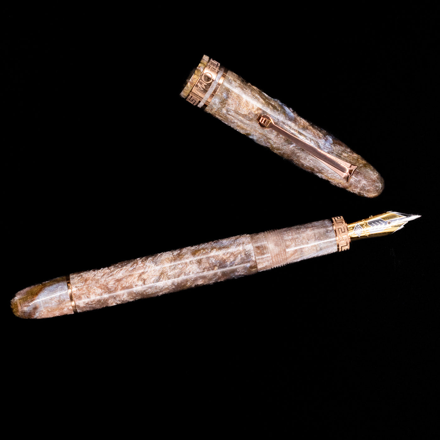 An overhead view of the OMAS Ogiva Cocktail Series Fountain Pen - Espresso Martini uncapped.