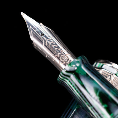A macro shot of the nib with its intricate detailing and logo engraving for the OMAS Paragon Fountain Pen - Arco Verde.