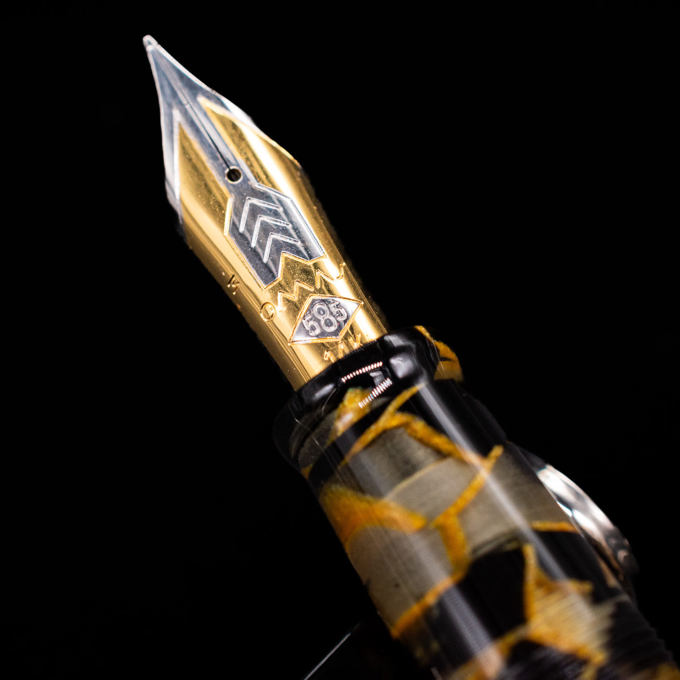 A macro shot of the nib with its intricate detailing and logo engraving for the OMAS Paragon Fountain Pen - Black Lucen.