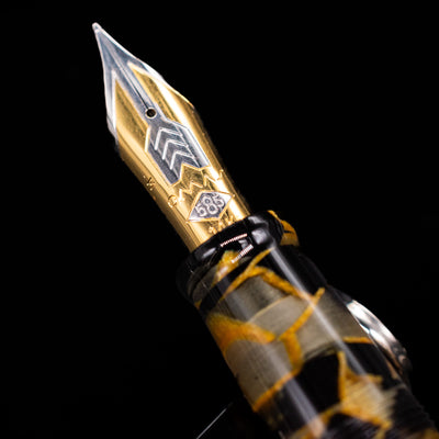 A macro shot of the nib with its intricate detailing and logo engraving for the OMAS Paragon Fountain Pen - Black Lucen.