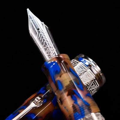 A macro shot of the nib with its intricate detailing and logo engraving for the OMAS Paragon Fountain Pen - Blue Lucen.