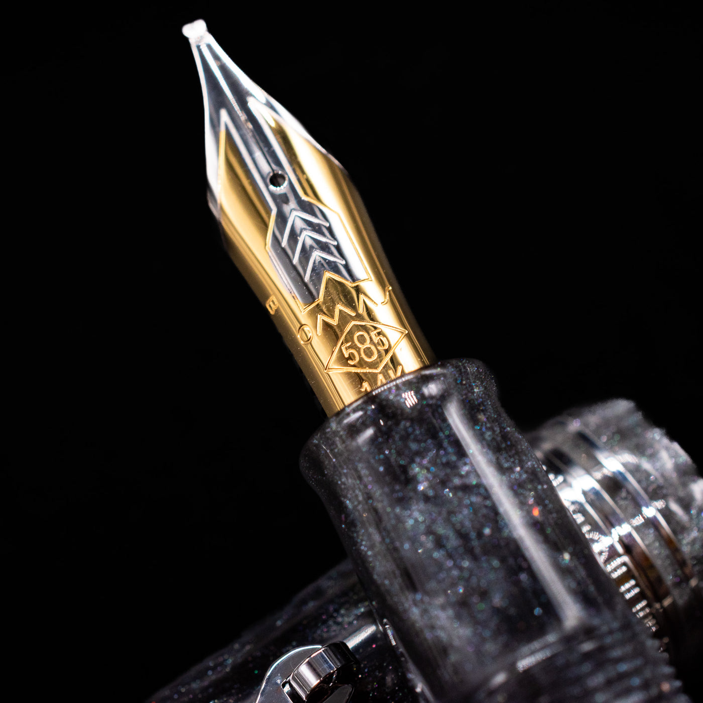 A macro shot of the nib with its intricate detailing and logo engraving for the Omas Bologna Fountain Pen - Bright Grey.