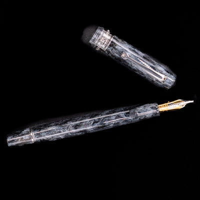 An overhead view of the Omas Bologna Fountain Pen - Bright Grey uncapped.