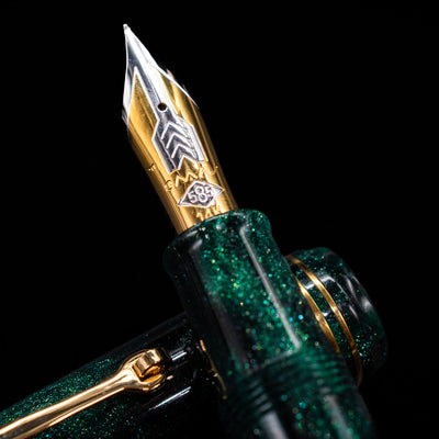  A macro shot of the nib with its intricate detailing and logo engraving for the Omas Bologna Fountain Pen - Elegant Emerald.