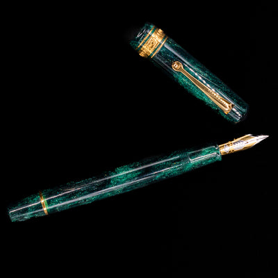 An overhead view of the Omas Bologna Fountain Pen - Elegant Emerald uncapped.