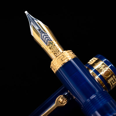 A macro shot of the nib with its intricate detailing and logo engraving for the Omas Ogiva Fountain Pen - Blue Gold.