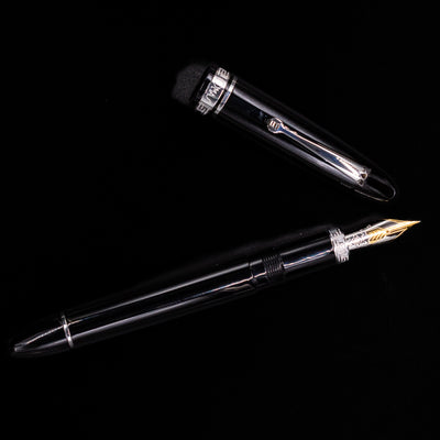 An overhead view of the Omas Ogiva Fountain Pen - Nera Silver uncapped.
