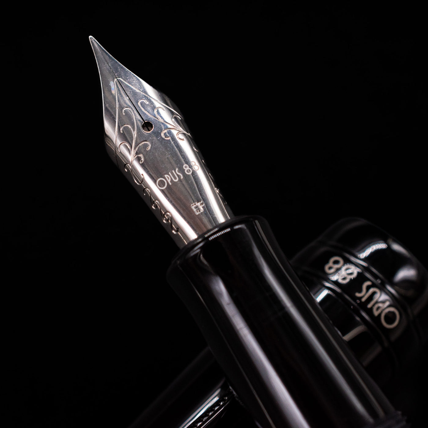  A macro shot of the nib with its intricate detailing and logo engraving for the Opus 88 Jazz Solid Black Fountain Pen - Preowned.