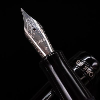  A macro shot of the nib with its intricate detailing and logo engraving for the Opus 88 Jazz Solid Black Fountain Pen - Preowned.