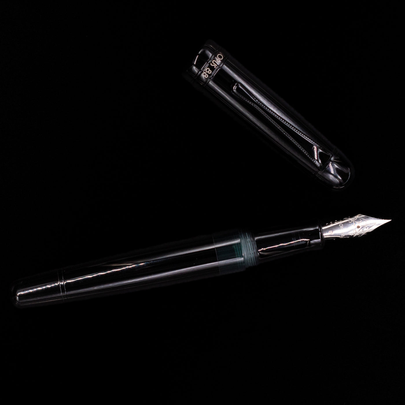 An overhead view of the Opus 88 Jazz Solid Black Fountain Pen - Preowned uncapped.