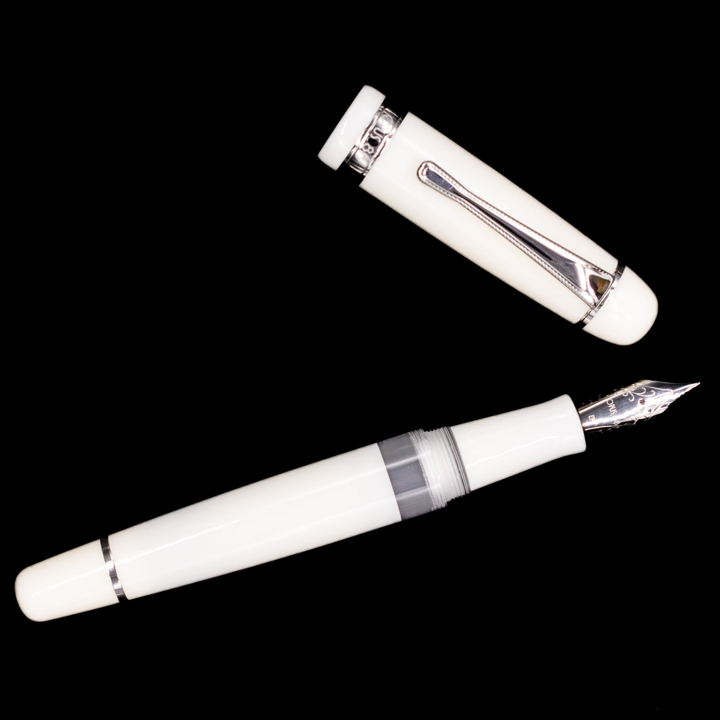 An overhead view of the Opus 88 Jazz Solid White Fountain Pen - Preowned uncapped.