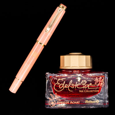 An overhead view of the new pen and ink within the Pelikan Classic M200 Fountain Pen Gift Set - Apricot Achat.