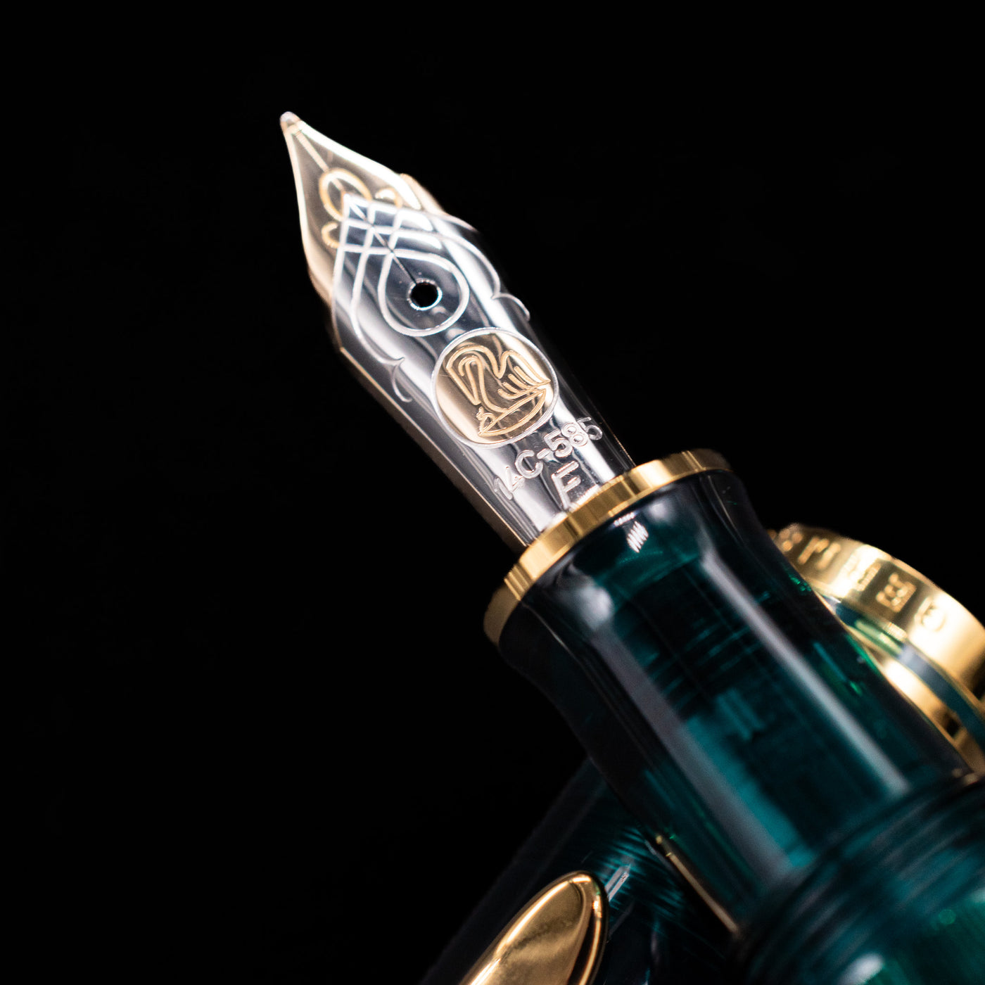 A macro shot of the nib with its intricate detailing and logo engraving for the Pelikan Souveran M605 Art Collection Fountain Pen - Rudi Rother.