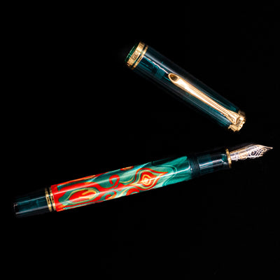 An overhead view of the Pelikan Souveran M605 Art Collection Fountain Pen - Rudi Rother uncapped.