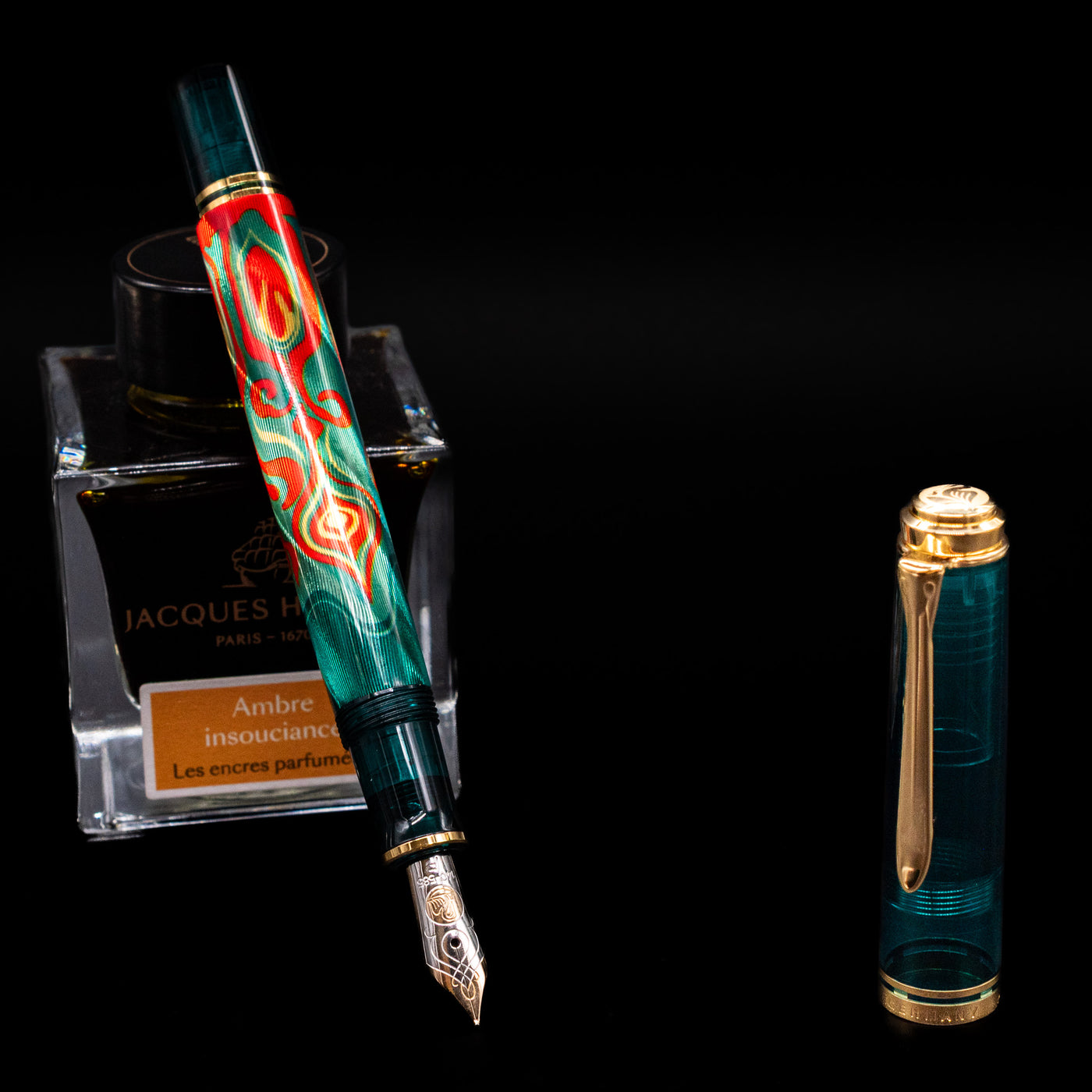 Pelikan Souveran M605 Art Collection Fountain Pen - Rudi Rother leaning on an ink bottle uncapped showcasing the detailing on the nib.