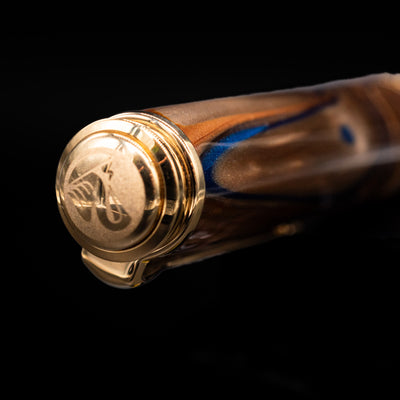 Zoomed-in view of the top of the cap with the finial on the Pelikan Souveran M800 Fountain Pen - Grand Place.