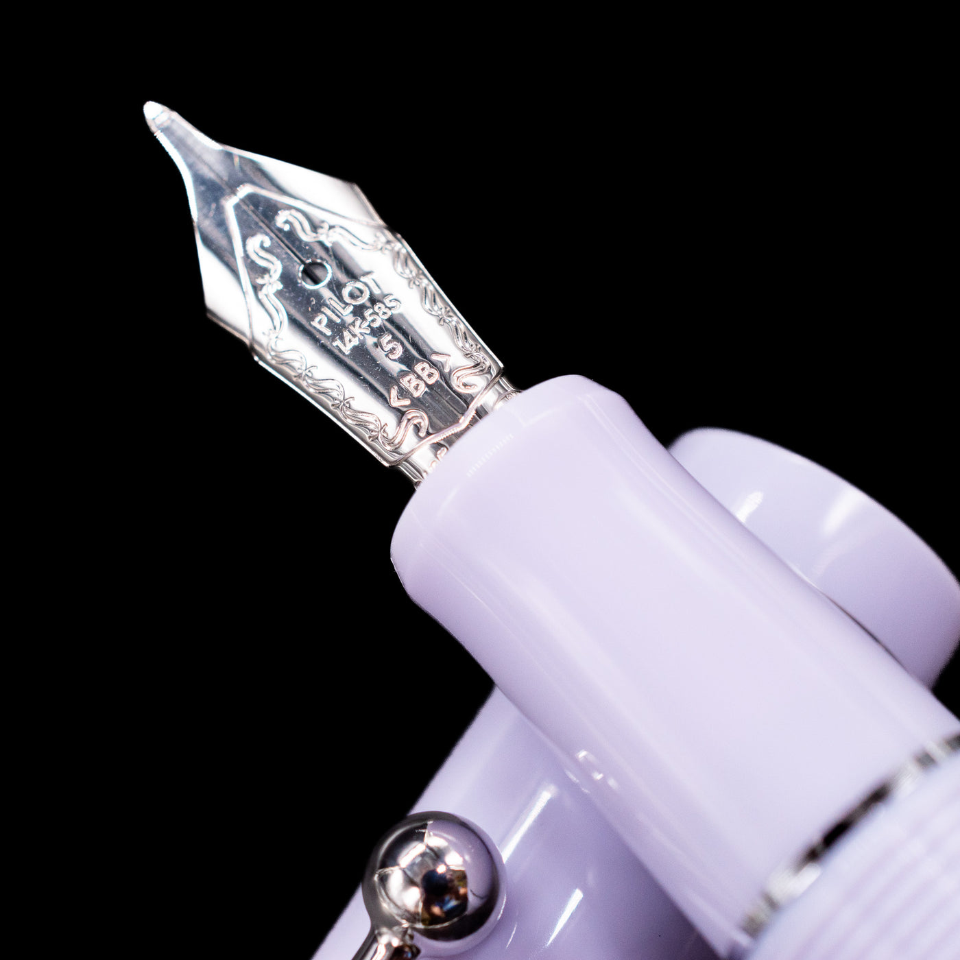  A macro shot of the nib with its intricate detailing and logo engraving for the Pilot Custom 74 Fountain Pen - Lavender Fog.
