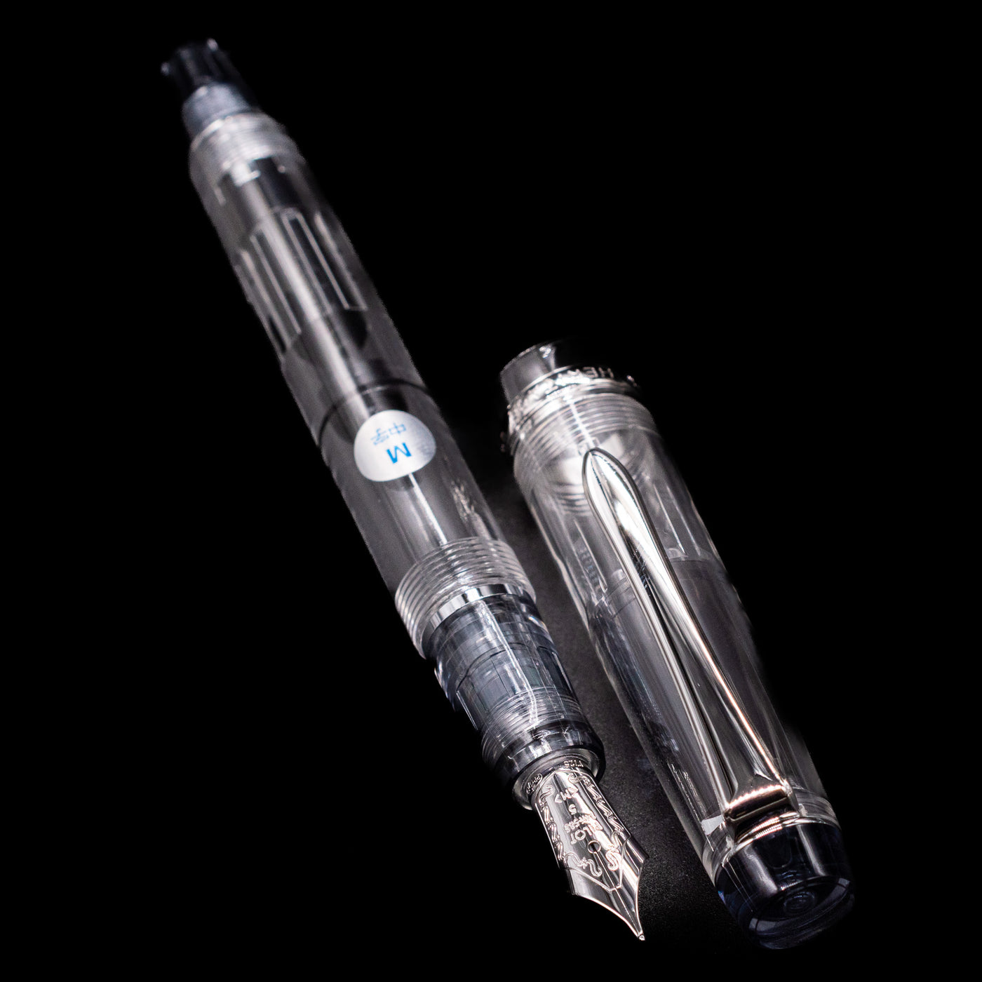 A full view of the Pilot Custom Heritage 92 Fountain Pen - Clear uncapped, with its cap laying next to the pen. 