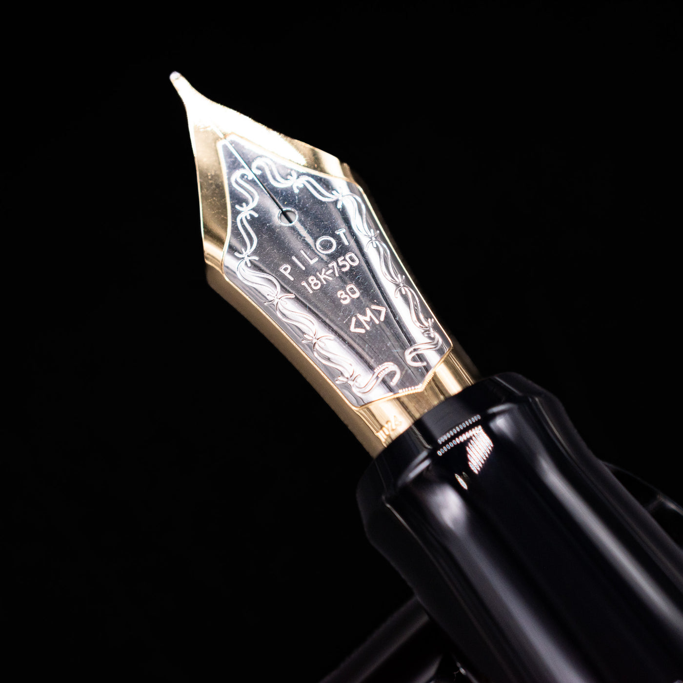 A macro shot of the nib with its intricate detailing and logo engraving for the Pilot Custom Urushi Fountain Pen - Black.