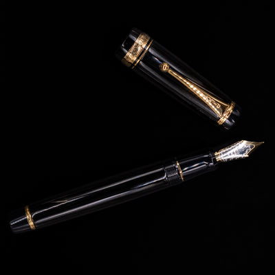 An overhead view of the Pilot Custom Urushi Fountain Pen - Black uncapped.