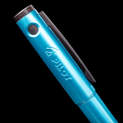 A detail shot of the side of the cap with the pilot logo on this Pilot Explorer Turquoise Blue Metal Fountain Pen.