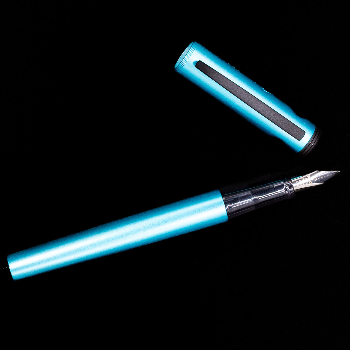 An overhead view of the Pilot Explorer Turquoise Blue Metal Fountain Pen uncapped.