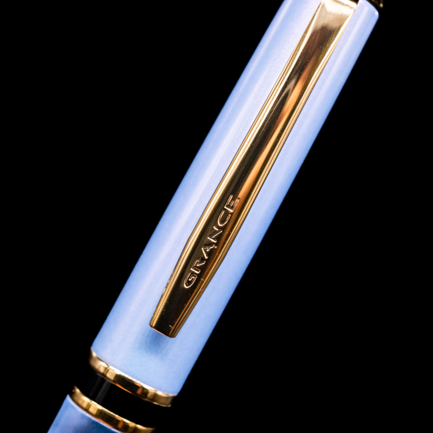 A close-up shot of the clip of the Pilot Grance Fountain Pen - Light Blue with the "grance" lettering.