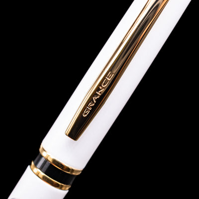 A close-up shot of the clip of the Pilot Grance Fountain Pen - Pearl White with the "grance" lettering.