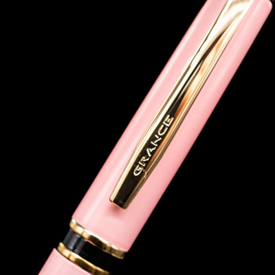 A close-up shot of the clip of the Pilot Grance Fountain Pen - Pink with the "grance" lettering.
