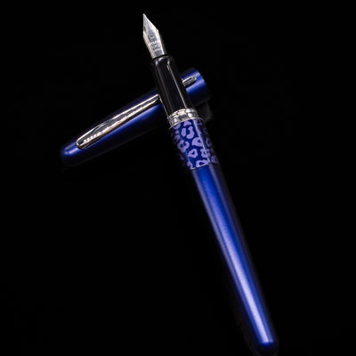 Pilot Metropolitan Fountain Pen - Leopard laying on top of its cap in a crossed position showing full view of the entire uncapped pen.
