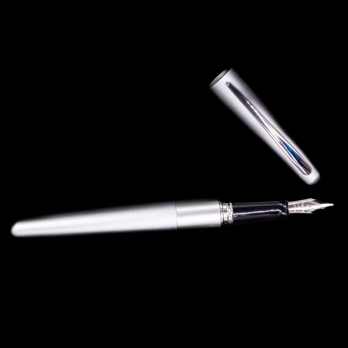 An overhead view of the Pilot Metropolitan Fountain Pen - Plain Silver uncapped.