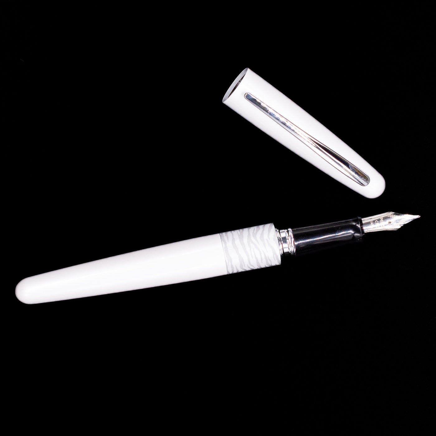 An overhead view of the Pilot Metropolitan Fountain Pen - White Tiger uncapped.