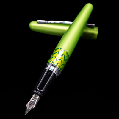 Pilot Metropolitan MR Retro Pop Fountain Pen - Green laying across its own cap, crossed, with a focus on the nib.