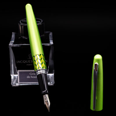 Pilot Metropolitan MR Retro Pop Fountain Pen - Green leaning on an ink bottle uncapped showcasing the detailing on the nib.