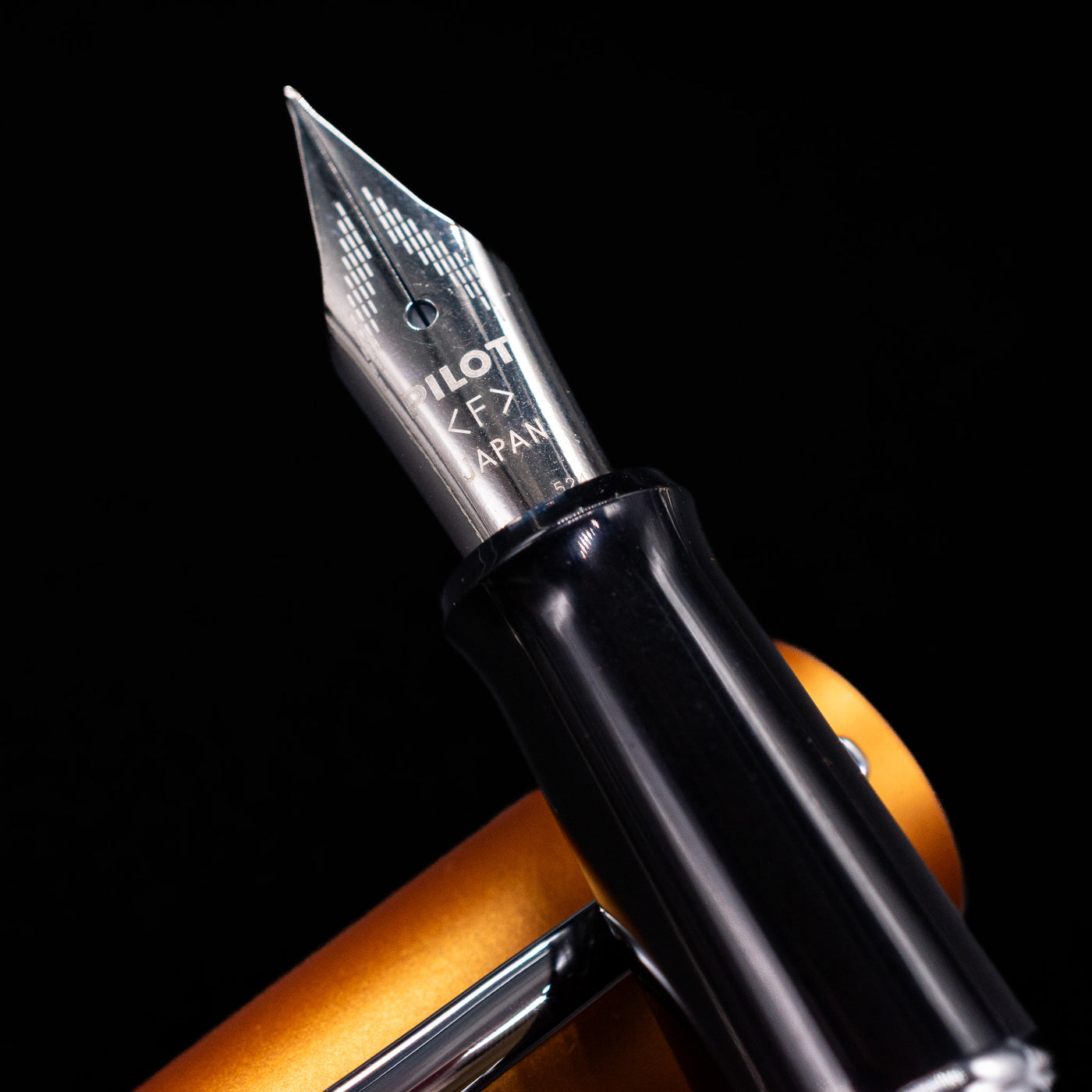  A macro shot of the nib with its intricate detailing and logo engraving for the Pilot Metropolitan MR Retro Pop Fountain Pen - Orange.