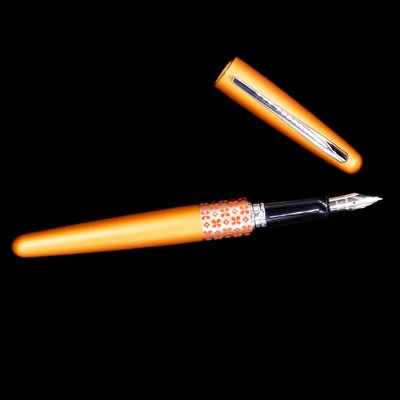 An overhead view of the Pilot Metropolitan MR Retro Pop Fountain Pen - Orange uncapped. 