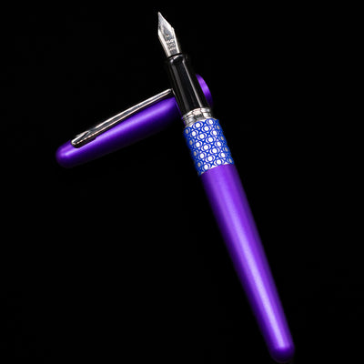 Pilot Metropolitan MR Retro Pop Fountain Pen - Purple laying on top of its cap in a crossed position showing full view of the entire uncapped pen.